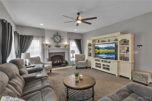 6132 Railroad St, Clarence, NY 14032 - carpeted living area featuring a ceiling fan, a tiled fireplace, and recessed lighting