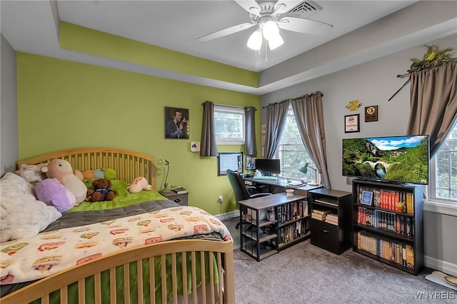 6132 Railroad St, Clarence, NY 14032 - carpeted bedroom with a tray ceiling and a ceiling fan