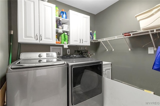 6132 Railroad St, Clarence, NY 14032 - washroom with independent washer and dryer and cabinet space