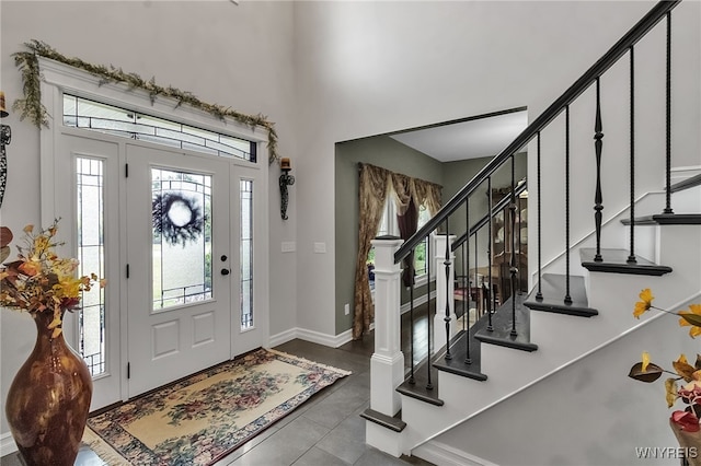 6132 Railroad St, Clarence, NY 14032 - tiled entrance foyer with healthy amount of natural light, stairway, and a towering ceiling
