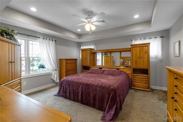6132 Railroad St, Clarence, NY 14032 - bedroom featuring light carpet, a tray ceiling, recessed lighting, and a ceiling fan