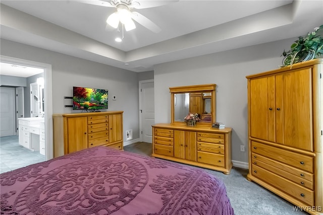 6132 Railroad St, Clarence, NY 14032 - carpeted bedroom featuring a tray ceiling and ensuite bath