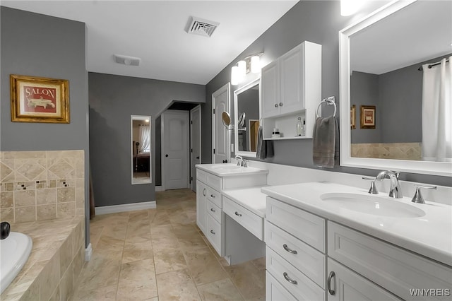 6132 Railroad St, Clarence, NY 14032 - full bath with double vanity and a garden tub