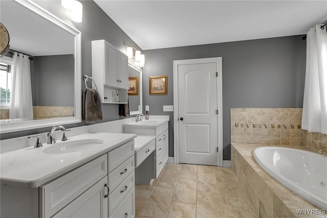 6132 Railroad St, Clarence, NY 14032 - full bathroom featuring two vanities and a bath