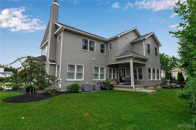 6132 Railroad St, Clarence, NY 14032 - back of property with a chimney and a lawn