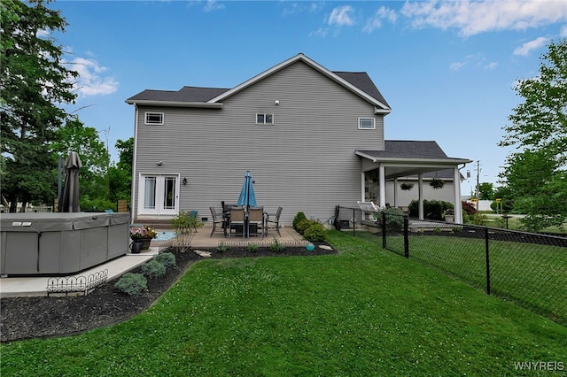 6132 Railroad St, Clarence, NY 14032 - back of house featuring a hot tub and a patio area