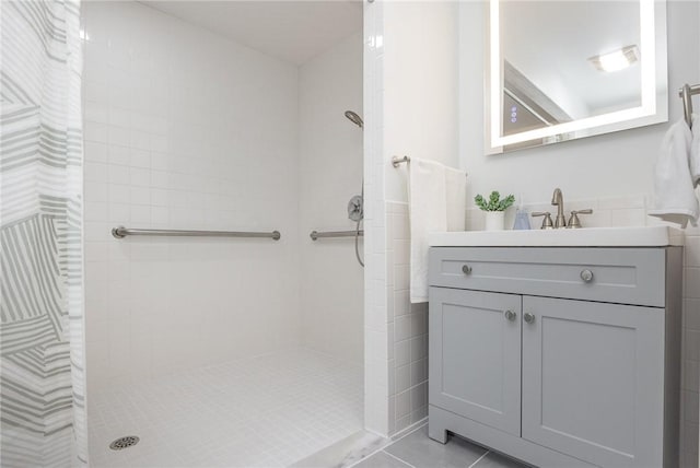 15 Kearney Dr, Irondequoit, NY 14617 - bathroom with tiled shower, vanity, and tile patterned flooring