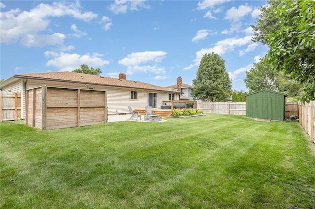 15 Kearney Dr, Irondequoit, NY 14617 - fenced backyard with a storage unit and an outdoor fire pit