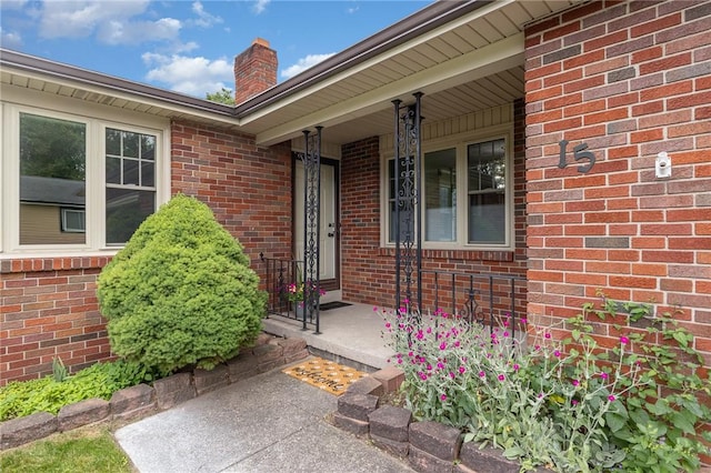 15 Kearney Dr, Irondequoit, NY 14617 - entrance to property featuring a chimney and brick siding