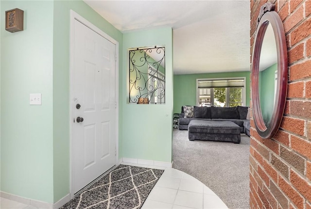 15 Kearney Dr, Irondequoit, NY 14617 - foyer with carpet flooring and tile patterned flooring
