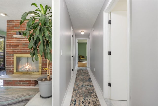 15 Kearney Dr, Irondequoit, NY 14617 - corridor featuring a textured ceiling and tile patterned flooring