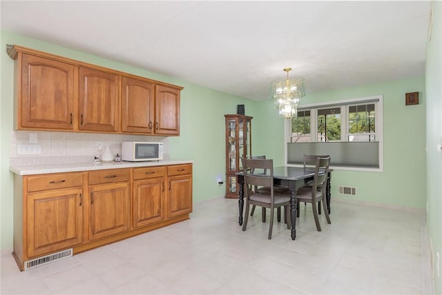 15 Kearney Dr, Irondequoit, NY 14617 - dining area with a chandelier