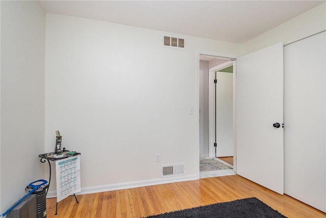 15 Kearney Dr, Irondequoit, NY 14617 - unfurnished bedroom featuring wood finished floors