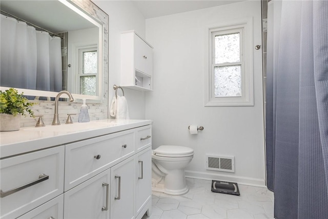 15 Kearney Dr, Irondequoit, NY 14617 - bathroom featuring vanity, plenty of natural light, backsplash, and a shower with curtain