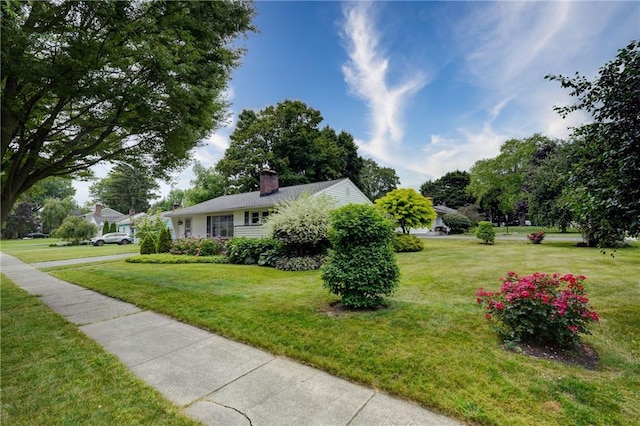 3201 Elmwood Ave, Brighton, NY 14618 - view of property exterior featuring a lawn and a chimney
