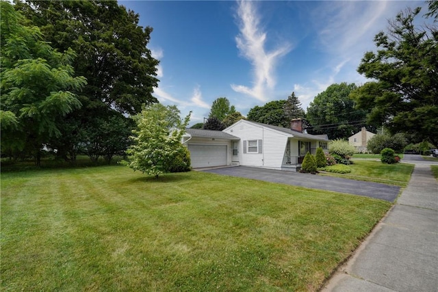 3201 Elmwood Ave, Brighton, NY 14618 - view of home's exterior with asphalt driveway, a yard, a chimney, and a garage