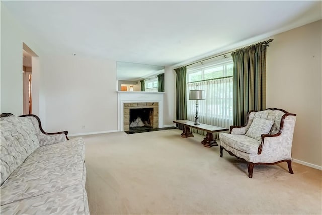 3201 Elmwood Ave, Brighton, NY 14618 - carpeted living area with baseboards and a stone fireplace