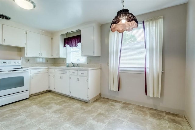 3201 Elmwood Ave, Brighton, NY 14618 - kitchen featuring electric stove, light countertops, and white cabinetry