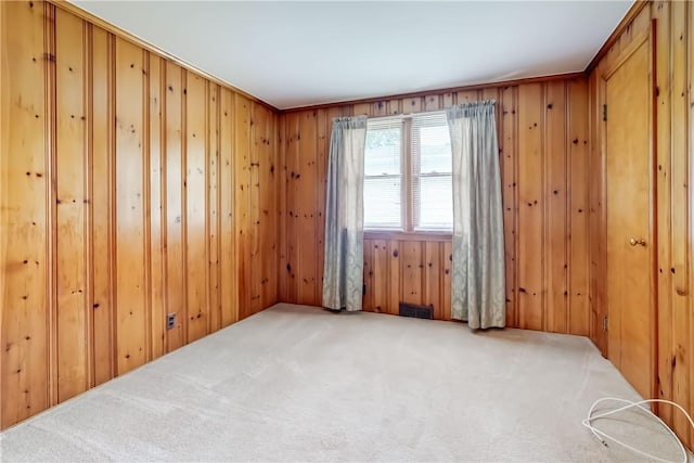 3201 Elmwood Ave, Brighton, NY 14618 - carpeted spare room with wood walls