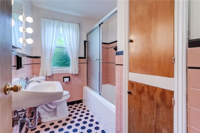 3201 Elmwood Ave, Brighton, NY 14618 - full bath featuring combined bath / shower with glass door, tile walls, and a wainscoted wall