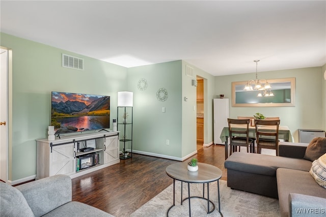 135 Charter Oaks Dr Unit 1, Amherst, NY 14228 - living area with wood finished floors and a chandelier
