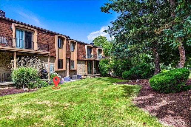 135 Charter Oaks Dr Unit 1, Amherst, NY 14228 - view of grassy yard featuring a balcony