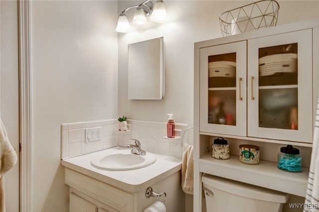 135 Charter Oaks Dr Unit 1, Amherst, NY 14228 - half bathroom with decorative backsplash and vanity