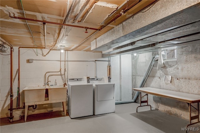 135 Charter Oaks Dr Unit 1, Amherst, NY 14228 - unfinished basement featuring separate washer and dryer and a sink