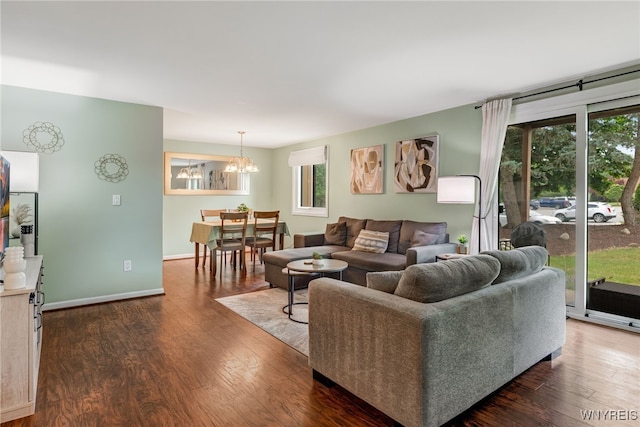 135 Charter Oaks Dr Unit 1, Amherst, NY 14228 - living room featuring a chandelier and dark wood-style flooring