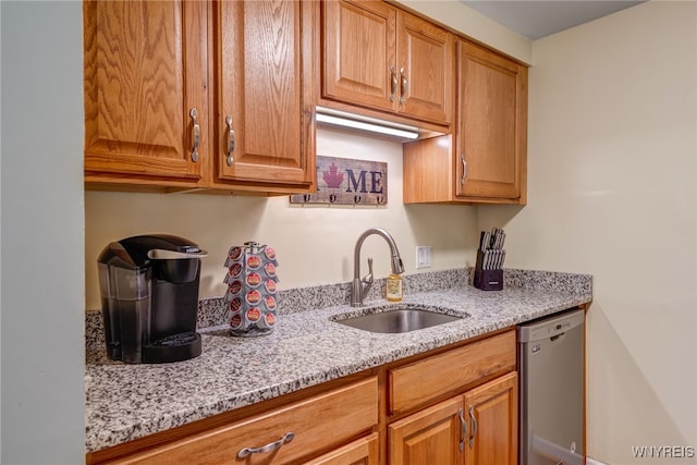 135 Charter Oaks Dr Unit 1, Amherst, NY 14228 - kitchen with dishwasher, light stone countertops, and brown cabinetry
