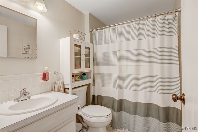 135 Charter Oaks Dr Unit 1, Amherst, NY 14228 - full bathroom with vanity, decorative backsplash, and a shower with curtain