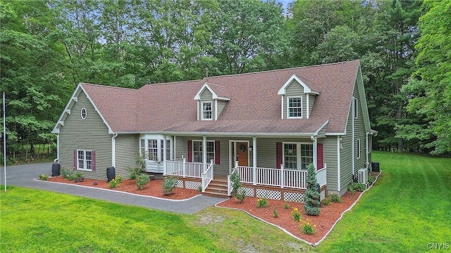 134 County Route 23a, Constantia, NY 13044 - cape cod-style house featuring covered porch and a front yard