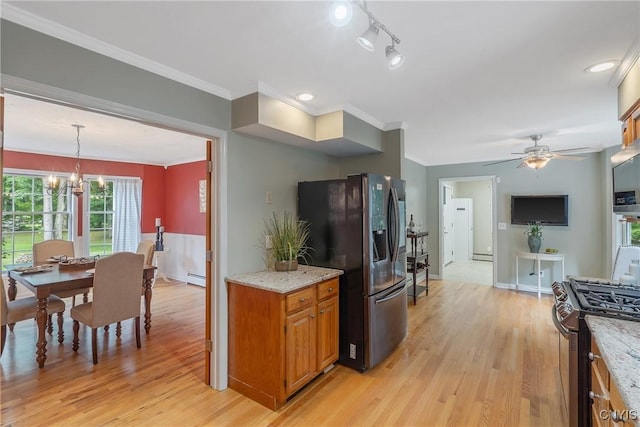 134 County Route 23a, Constantia, NY 13044 - kitchen with stainless steel appliances, brown cabinetry, crown molding, light wood-style floors, and a chandelier