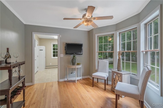 134 County Route 23a, Constantia, NY 13044 - sitting room with ceiling fan, a baseboard heating unit, light wood-style floors, and ornamental molding