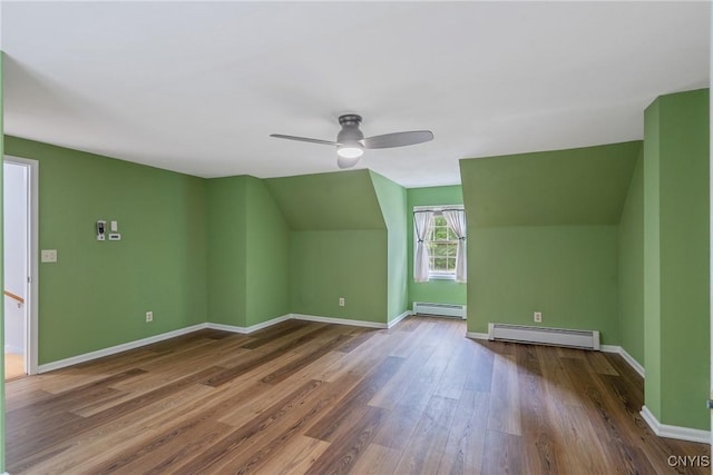 134 County Route 23a, Constantia, NY 13044 - additional living space featuring baseboard heating, wood finished floors, ceiling fan, and vaulted ceiling