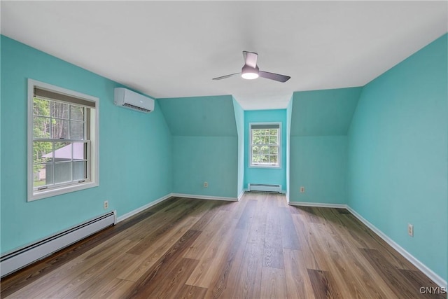 134 County Route 23a, Constantia, NY 13044 - bonus room featuring a wall mounted AC, baseboard heating, a baseboard radiator, wood finished floors, and ceiling fan