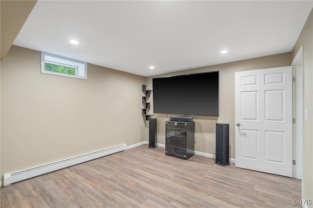 134 County Route 23a, Constantia, NY 13044 - below grade area with a baseboard heating unit, wood finished floors, and recessed lighting