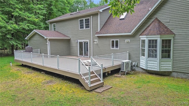 134 County Route 23a, Constantia, NY 13044 - back of house featuring a lawn, a wooden deck, and a shingled roof