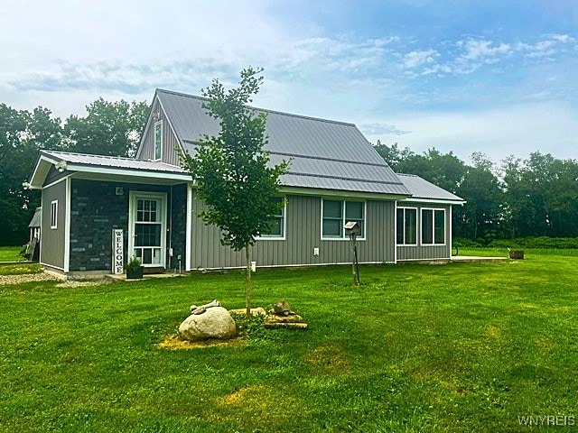 2473 Bunker Hill Rd, Cold Spring, NY 14772 - rear view of property with a yard and a metal roof