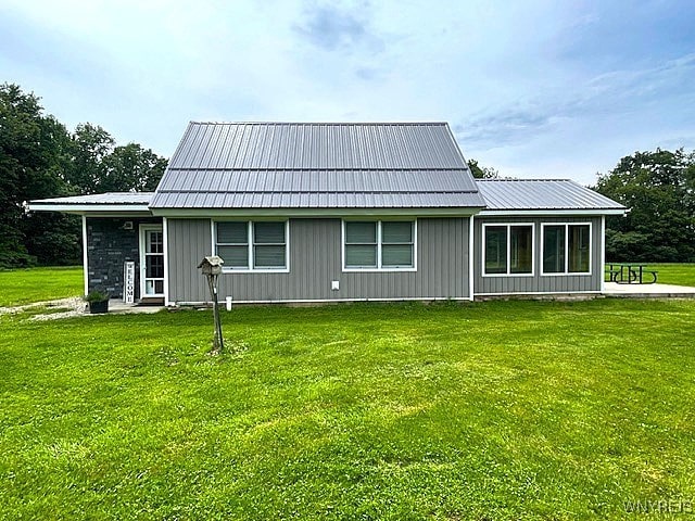 2473 Bunker Hill Rd, Cold Spring, NY 14772 - rear view of house with a lawn, a metal roof, and board and batten siding