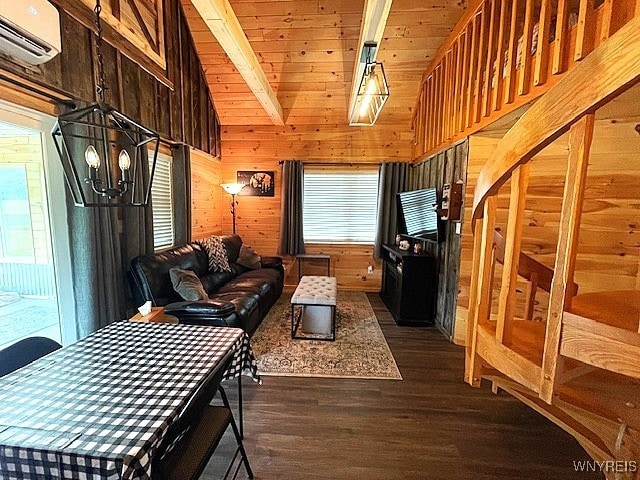 2473 Bunker Hill Rd, Cold Spring, NY 14772 - living area with wood walls, a chandelier, a wall mounted AC, dark wood-type flooring, and healthy amount of natural light