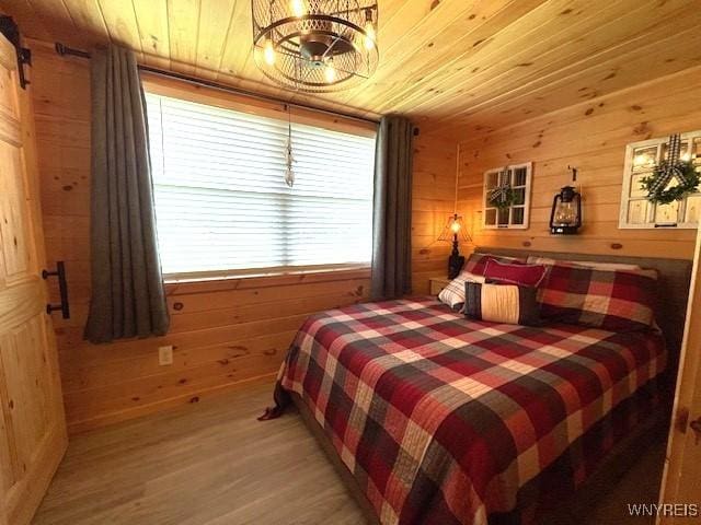 2473 Bunker Hill Rd, Cold Spring, NY 14772 - bedroom with wood walls, light wood finished floors, and wooden ceiling