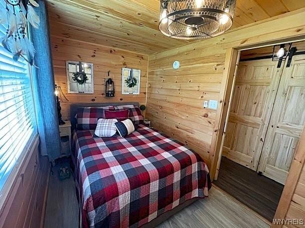 2473 Bunker Hill Rd, Cold Spring, NY 14772 - bedroom with wooden walls, wood ceiling, and wood finished floors