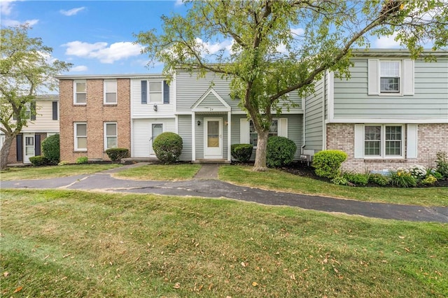 24 Huntsman, Webster, NY 14580 - townhome / multi-family property with brick siding and a front yard