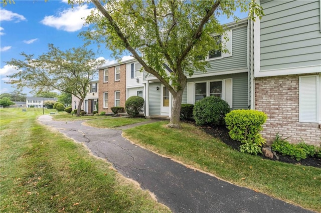 24 Huntsman, Webster, NY 14580 - townhome / multi-family property with brick siding and a front yard