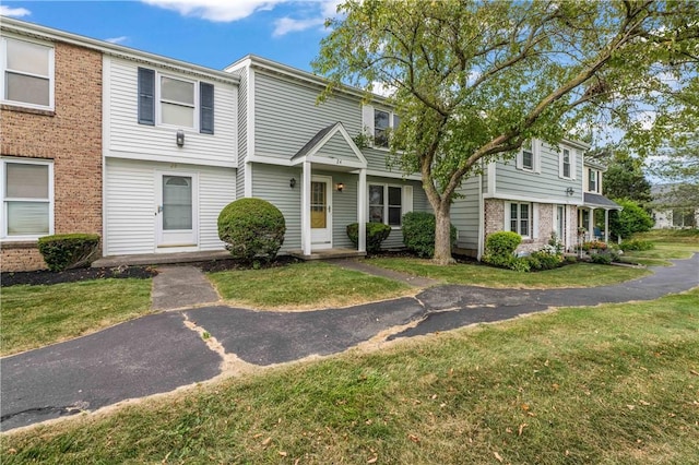 24 Huntsman, Webster, NY 14580 - view of front of house featuring a front yard and brick siding