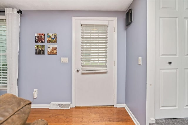 24 Huntsman, Webster, NY 14580 - entryway featuring baseboards and light wood-type flooring