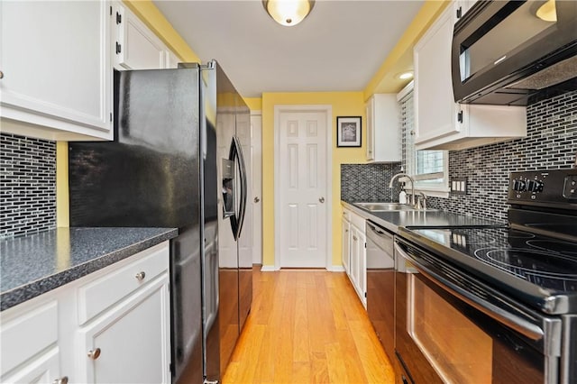 24 Huntsman, Webster, NY 14580 - kitchen with black appliances, white cabinets, light wood finished floors, and backsplash