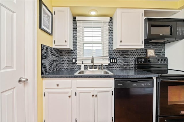 24 Huntsman, Webster, NY 14580 - kitchen with black appliances, dark countertops, white cabinets, and backsplash