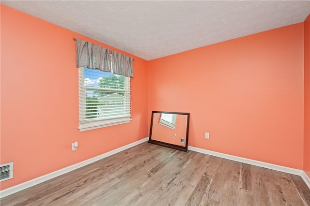 24 Huntsman, Webster, NY 14580 - spare room with wood finished floors and a textured ceiling